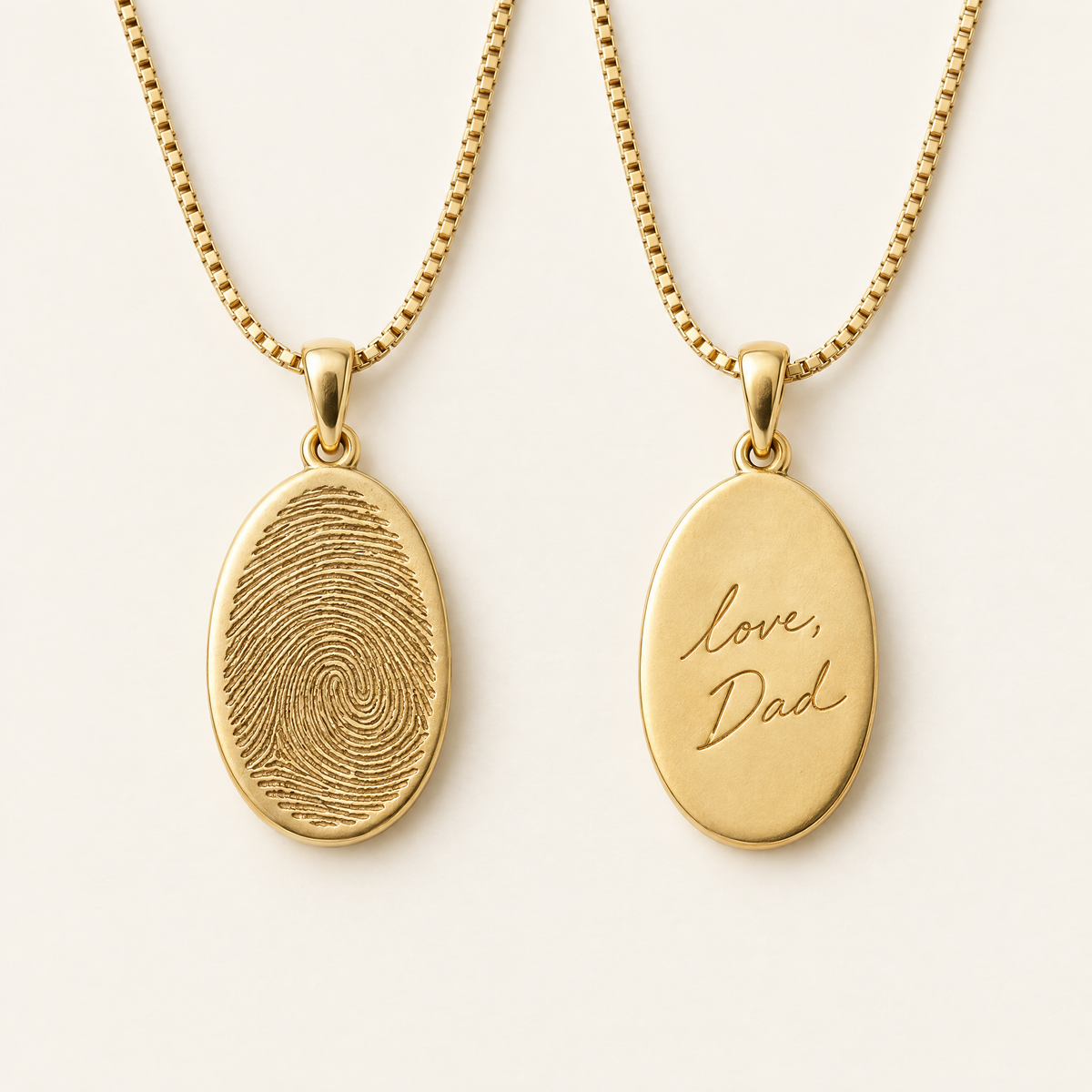 Front and back of the gold fingerprint pendant, with handwritten engraving on the back